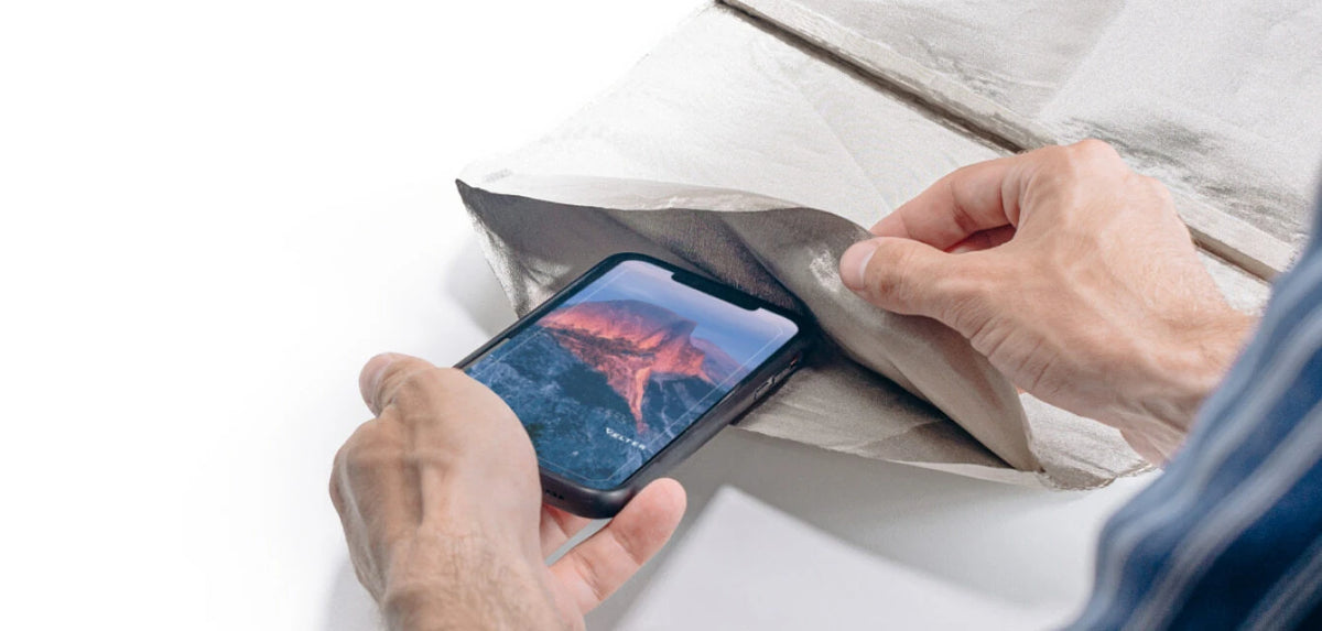 Phone wrapped in shielding fabric