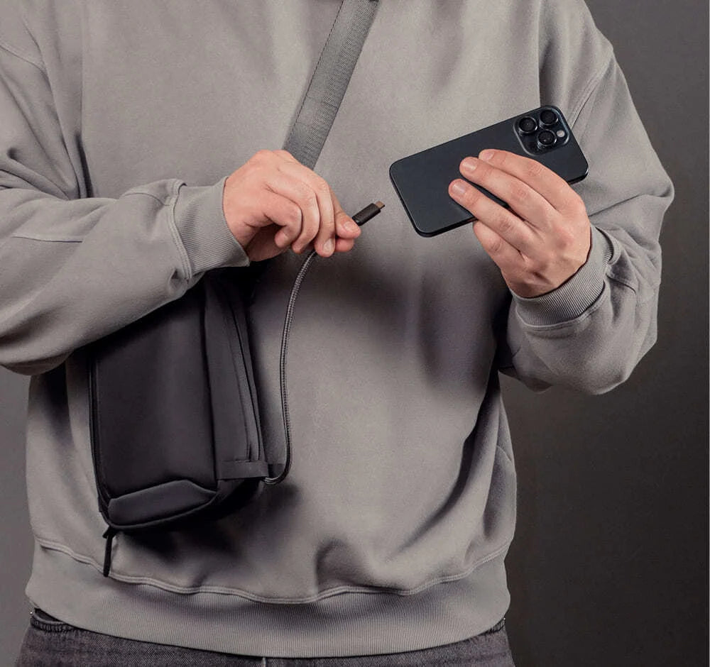 Charging a phone from the sling bag with a cable