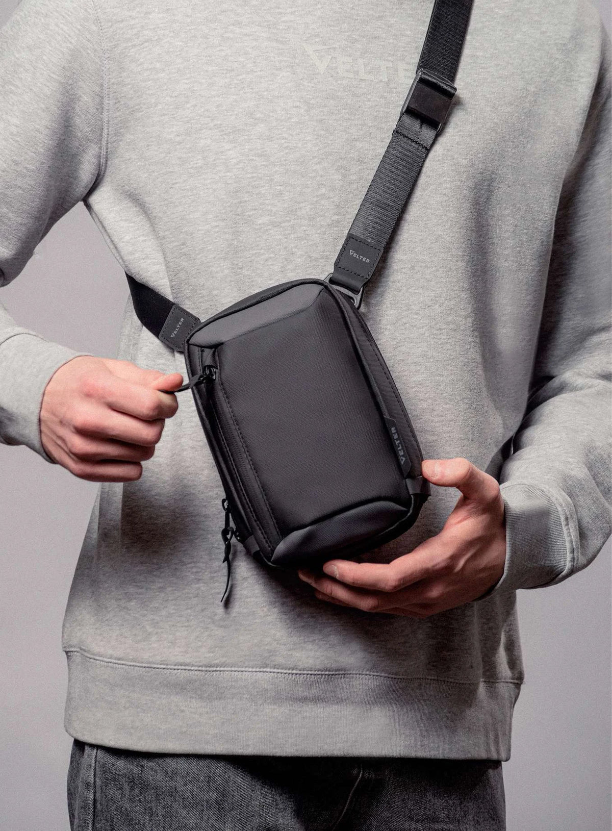 Sling bag worn crossbody on the chest
